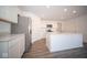 Modern kitchen with stainless steel refrigerator and island at 1426 Bluebonnet Pl, Shelbyville, IN 46176