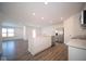 Modern kitchen with island, stainless steel appliances and wood-look floors at 1426 Bluebonnet Pl, Shelbyville, IN 46176