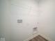 Bright laundry room with built-in shelving and vinyl flooring at 1426 Bluebonnet Pl, Shelbyville, IN 46176