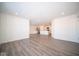 Spacious living area with wood-look floors and kitchen views at 1426 Bluebonnet Pl, Shelbyville, IN 46176