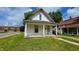 Charming two-story home featuring a cozy front porch, quaint design, and a well-maintained lawn at 310 S Pleasant St, Edinburgh, IN 46124