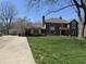 Charming two-story brick home with a well-manicured lawn and a long driveway at 4256 Bending Ln, Greenwood, IN 46143