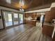 Large kitchen with a center island, wood cabinets, and a view to the backyard patio at 4256 Bending Ln, Greenwood, IN 46143