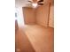 Carpeted bedroom with ceiling fan and door at 4835 Franklin Villas Dr, Indianapolis, IN 46237