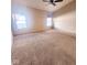 Large main bedroom with carpet and ceiling fan at 4835 Franklin Villas Dr, Indianapolis, IN 46237
