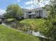 Exterior view of townhomes featuring patios and balconies overlooking a beautiful waterway at 8520 Bison Woods Ct, Indianapolis, IN 46227