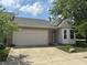 Charming single-Gathering home with a two-car garage, brick accents, and a well-manicured lawn at 8520 Bison Woods Ct, Indianapolis, IN 46227