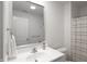 Bathroom with white vanity, mirror and shower at 1501 Coen Ct, Columbus, IN 47201