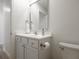 Bathroom with white vanity and large mirror at 1501 Coen Ct, Columbus, IN 47201