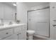 Modern bathroom featuring a shower and white cabinets at 1501 Coen Ct, Columbus, IN 47201