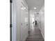 Bright hallway with white doors and grey wood-look floors at 1501 Coen Ct, Columbus, IN 47201