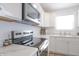 Bright kitchen with stainless steel appliances and white cabinetry at 1501 Coen Ct, Columbus, IN 47201