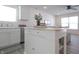 White kitchen island with butcher block top and storage at 1501 Coen Ct, Columbus, IN 47201