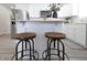 Kitchen island with wooden top and two industrial stools at 1501 Coen Ct, Columbus, IN 47201
