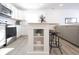 White kitchen island with a wooden top and open shelving at 1501 Coen Ct, Columbus, IN 47201