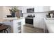 Modern kitchen with stainless steel appliances and white cabinets at 1501 Coen Ct, Columbus, IN 47201