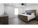 King-size bed, nightstands, and ceiling fan at 1501 Coen Ct, Columbus, IN 47201