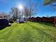 Expansive backyard with a pristine lawn and swim spa, offering a serene and private outdoor retreat at 562 Nelson Dr, Brownsburg, IN 46112