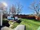 Lush backyard features a modern swim spa and a well-maintained lawn, perfect for outdoor enjoyment at 562 Nelson Dr, Brownsburg, IN 46112