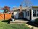 The house's rear exterior, featuring a fenced yard, a grill, and access to a screened porch at 562 Nelson Dr, Brownsburg, IN 46112