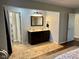 This is a double vanity bathroom with a large mirror, granite countertop, and an adjoining shower at 562 Nelson Dr, Brownsburg, IN 46112