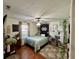 Bedroom features an accent tapestry, ceiling fan, house plants, and plenty of natural light from a window at 562 Nelson Dr, Brownsburg, IN 46112
