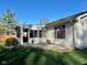 Home exterior featuring a sunroom with sliding glass doors and vinyl siding with red shutters at 562 Nelson Dr, Brownsburg, IN 46112