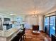 Modern kitchen with a breakfast bar, stainless steel appliances, and sliding door at 562 Nelson Dr, Brownsburg, IN 46112