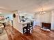 Charming kitchen with a breakfast bar, stainless steel appliances, and white cabinets at 562 Nelson Dr, Brownsburg, IN 46112