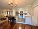 Open kitchen with a breakfast bar, stainless steel appliances, and view to the living room at 562 Nelson Dr, Brownsburg, IN 46112