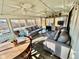 Cozy sunroom with ample seating, a dining table, and views of the landscaped backyard, perfect for relaxing at 562 Nelson Dr, Brownsburg, IN 46112