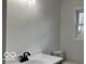 Well-lit bathroom with a clean vanity and sleek fixtures, enhanced by a bright window view at 11 S 1050 W, Jamestown, IN 46147