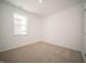 Cozy bedroom featuring a large window and neutral carpet at 132 Velvet Hat Rd, Danville, IN 46122