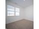 Bright, carpeted bedroom with a large window offering natural light at 132 Velvet Hat Rd, Danville, IN 46122