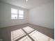 Bedroom with carpeted floors, a large window for natural light, and fresh white walls at 132 Velvet Hat Rd, Danville, IN 46122