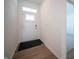 Bright entryway featuring a sleek front door and hardwood floors at 132 Velvet Hat Rd, Danville, IN 46122