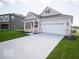 Attractive single-story home with a two-car garage, covered porch, and a well-manicured front yard at 132 Velvet Hat Rd, Danville, IN 46122