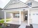 Cozy covered porch with white columns and black shutters adds charm to this attractive single-story home at 132 Velvet Hat Rd, Danville, IN 46122
