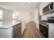 Well-equipped modern kitchen boasts stainless steel appliances, a center island, and sleek countertops at 132 Velvet Hat Rd, Danville, IN 46122