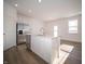 Kitchen with stainless appliances, white cabinets, and view to the backyard with glass door and window at 132 Velvet Hat Rd, Danville, IN 46122