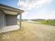 Back patio offers serene views of the water and fountain at 120 Velvet Hat Rd, Danville, IN 46122
