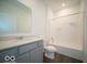 Modern bathroom featuring a vanity with granite countertop and a shower-tub combination at 120 Velvet Hat Rd, Danville, IN 46122