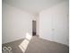 Bright bedroom with neutral carpet, white walls, and plenty of space to personalize at 120 Velvet Hat Rd, Danville, IN 46122