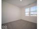 Cozy bedroom filled with natural light, featuring neutral carpeting and a large window at 120 Velvet Hat Rd, Danville, IN 46122