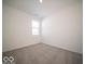 A carpeted bedroom with a window lets in natural light at 120 Velvet Hat Rd, Danville, IN 46122