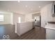 Open-concept kitchen boasts a kitchen island, stainless steel appliances, and plenty of counter space at 120 Velvet Hat Rd, Danville, IN 46122