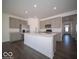 A stylish kitchen boasts gray cabinets, stainless steel appliances, and a central kitchen island at 120 Velvet Hat Rd, Danville, IN 46122