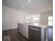 Bright kitchen island featuring stainless steel dishwasher and undermount sink at 120 Velvet Hat Rd, Danville, IN 46122
