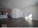Open-concept living space features wood-style floors that connects to the kitchen area at 120 Velvet Hat Rd, Danville, IN 46122