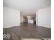 Open-concept living space features wood-style floors that connects to the kitchen area at 120 Velvet Hat Rd, Danville, IN 46122